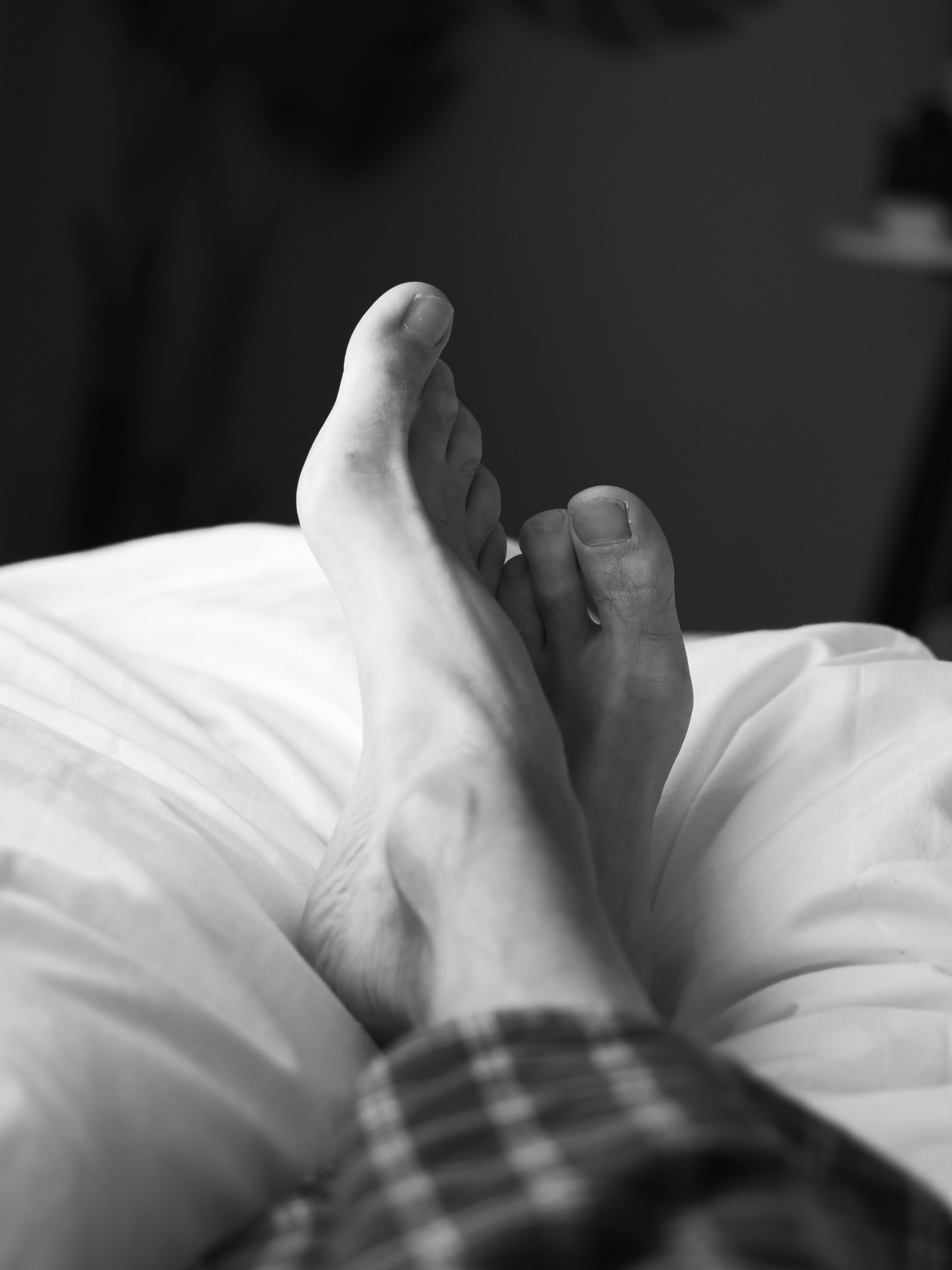Resting feet on a bed