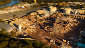 Construction site with heavy machinery and debris