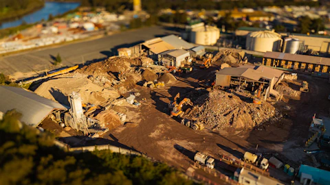 Construction site with heavy machinery and debris