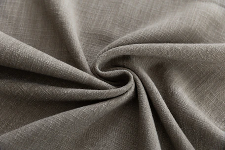 Textured gray fabric folded in a swirl