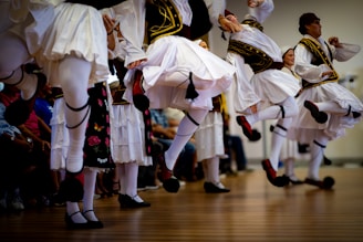 Men in traditional greek costumes dancing