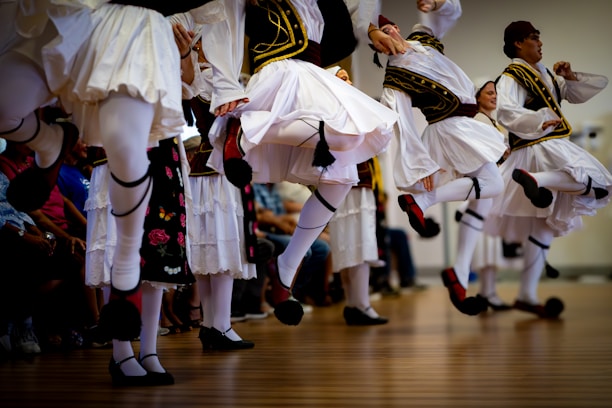 Men in traditional greek costumes dancing