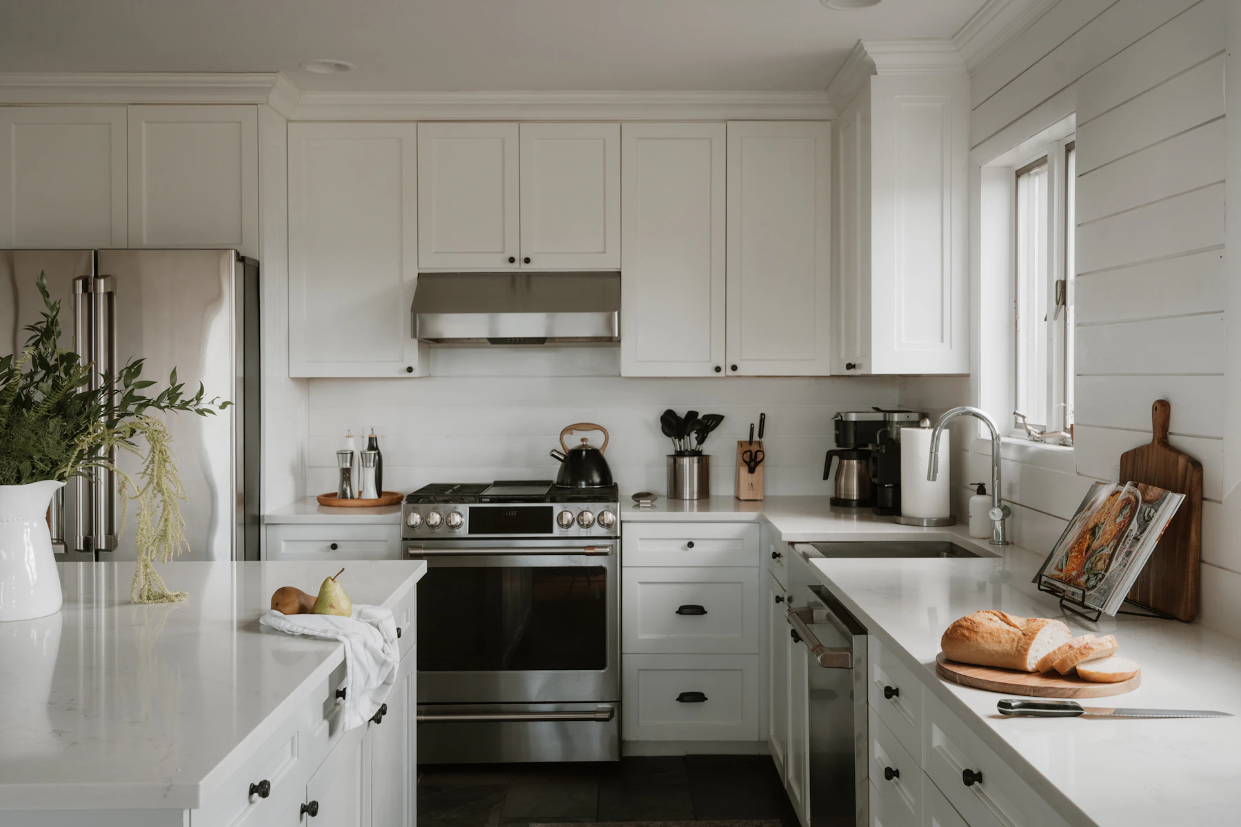 Bright modern kitchen with a clean countertop, kettle and everyday kitchen preparation space