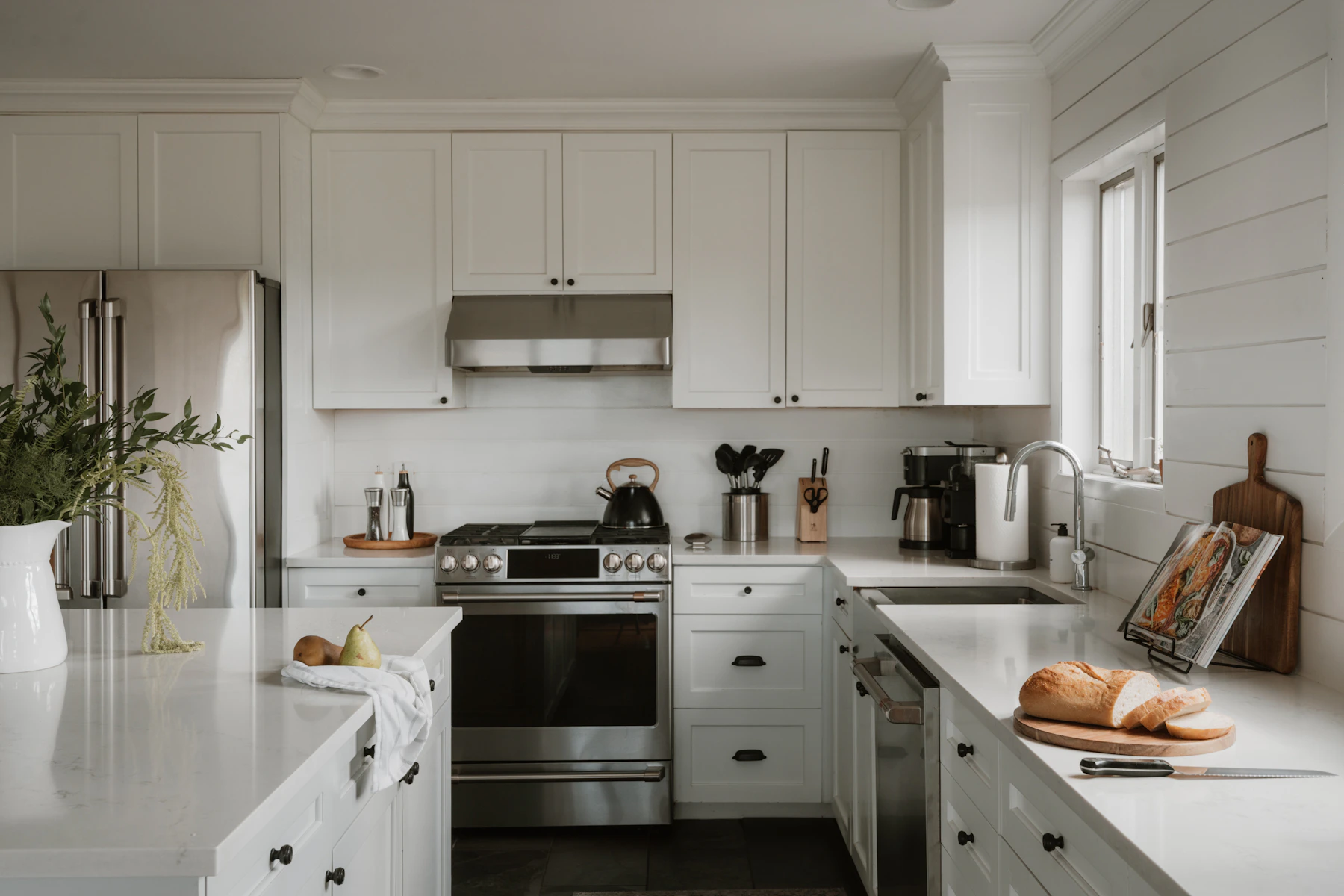 Bright kitchen with extensive cabinetry and a working counter