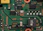 Close-up of a green circuit board with electronic components.