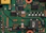 Close-up of a green circuit board with electronic components.