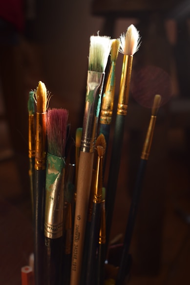 Assortment of paintbrushes in a container.