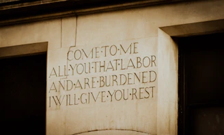 Engraved text on a stone pillar offers rest