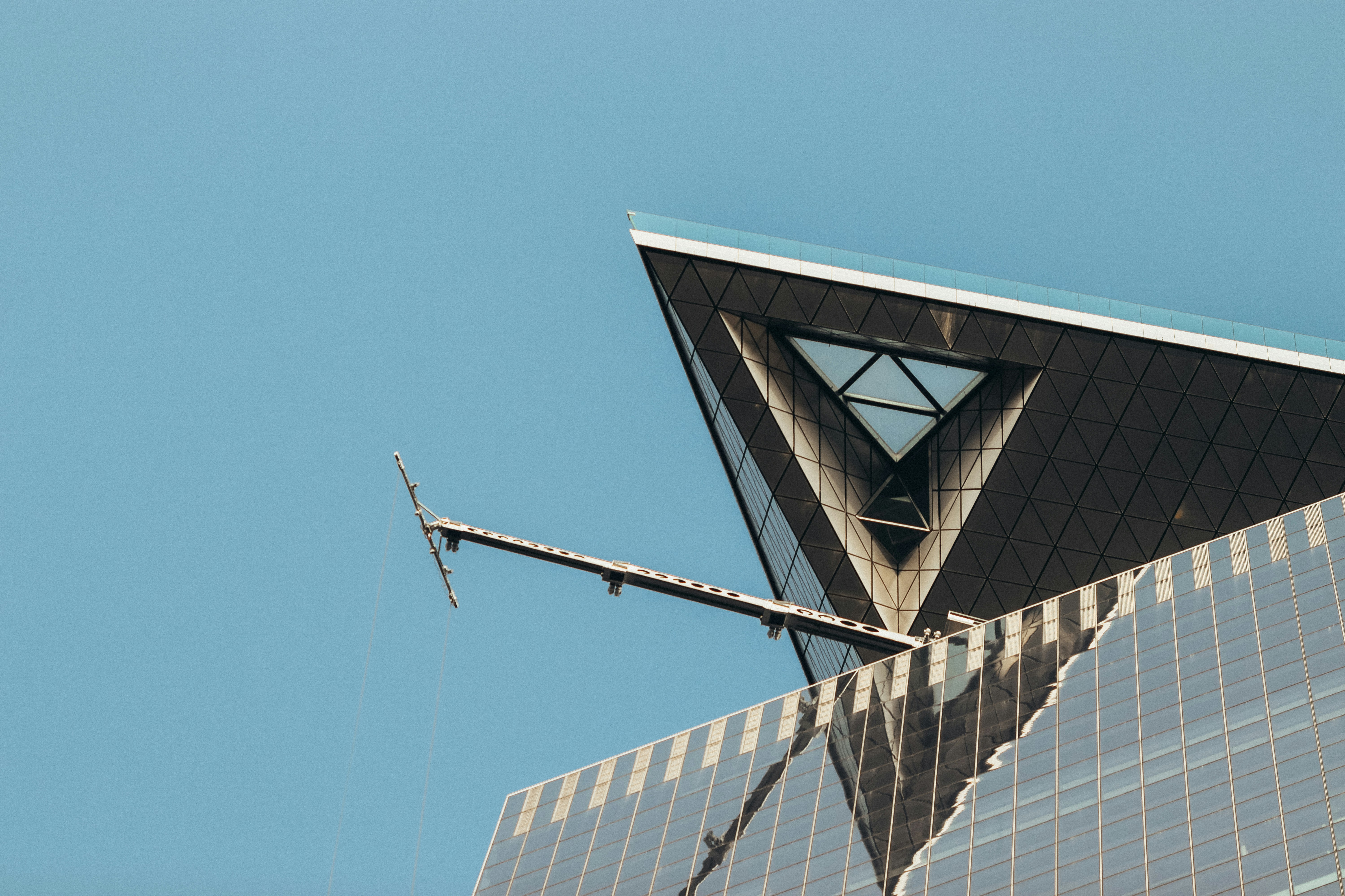 Modern skyscraper architecture against a clear blue sky