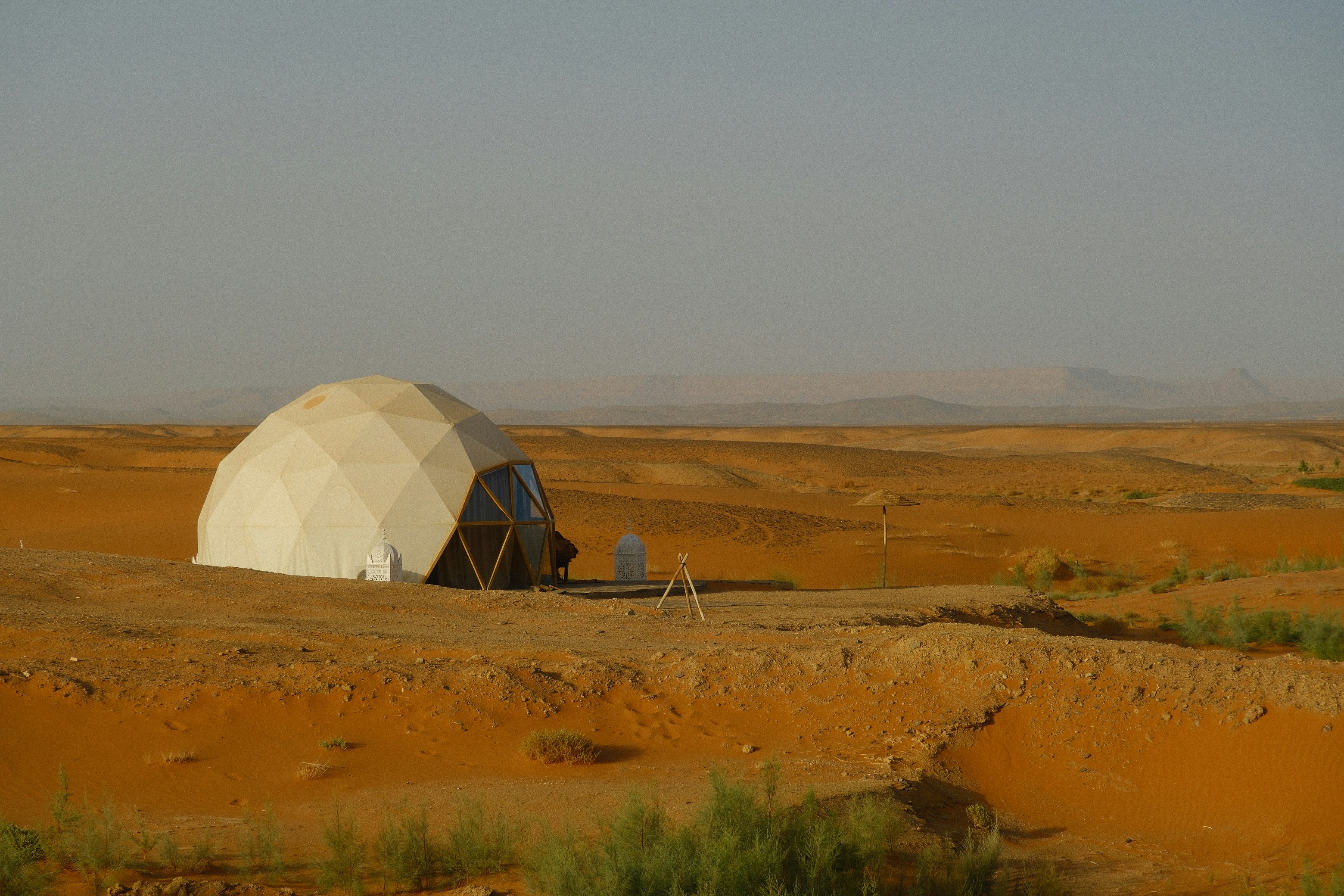 Geodesic dome glamping tent in a desert landscape