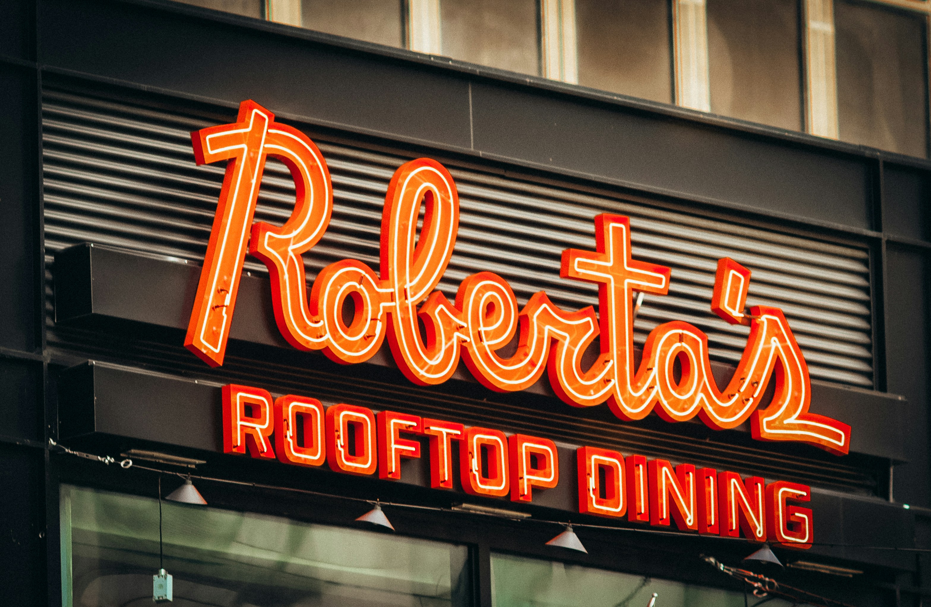 Neon sign for roberta's rooftop dining