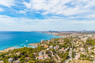 Coastal city with blue ocean and green hills