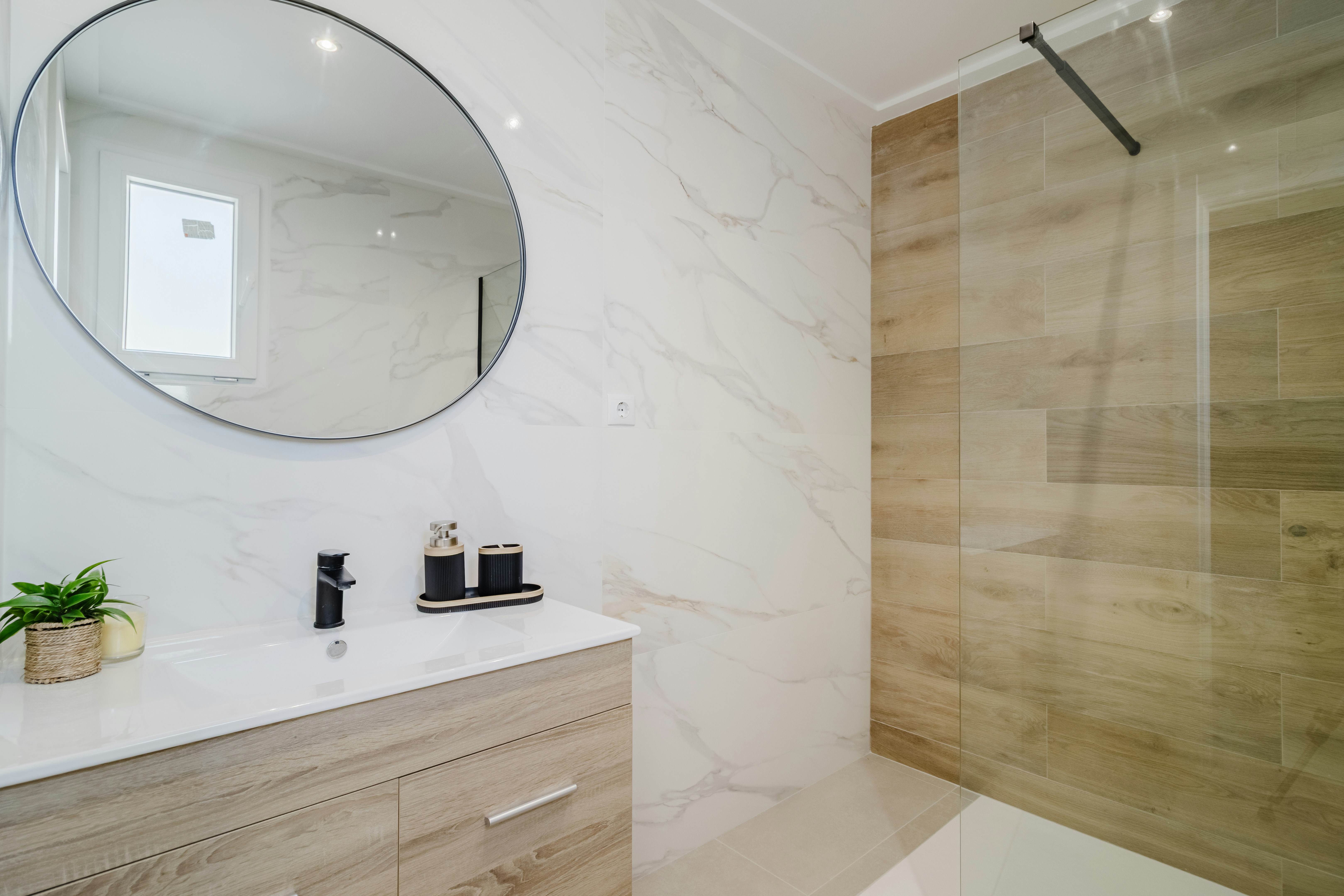 Modern bathroom with marble accents and walk-in shower