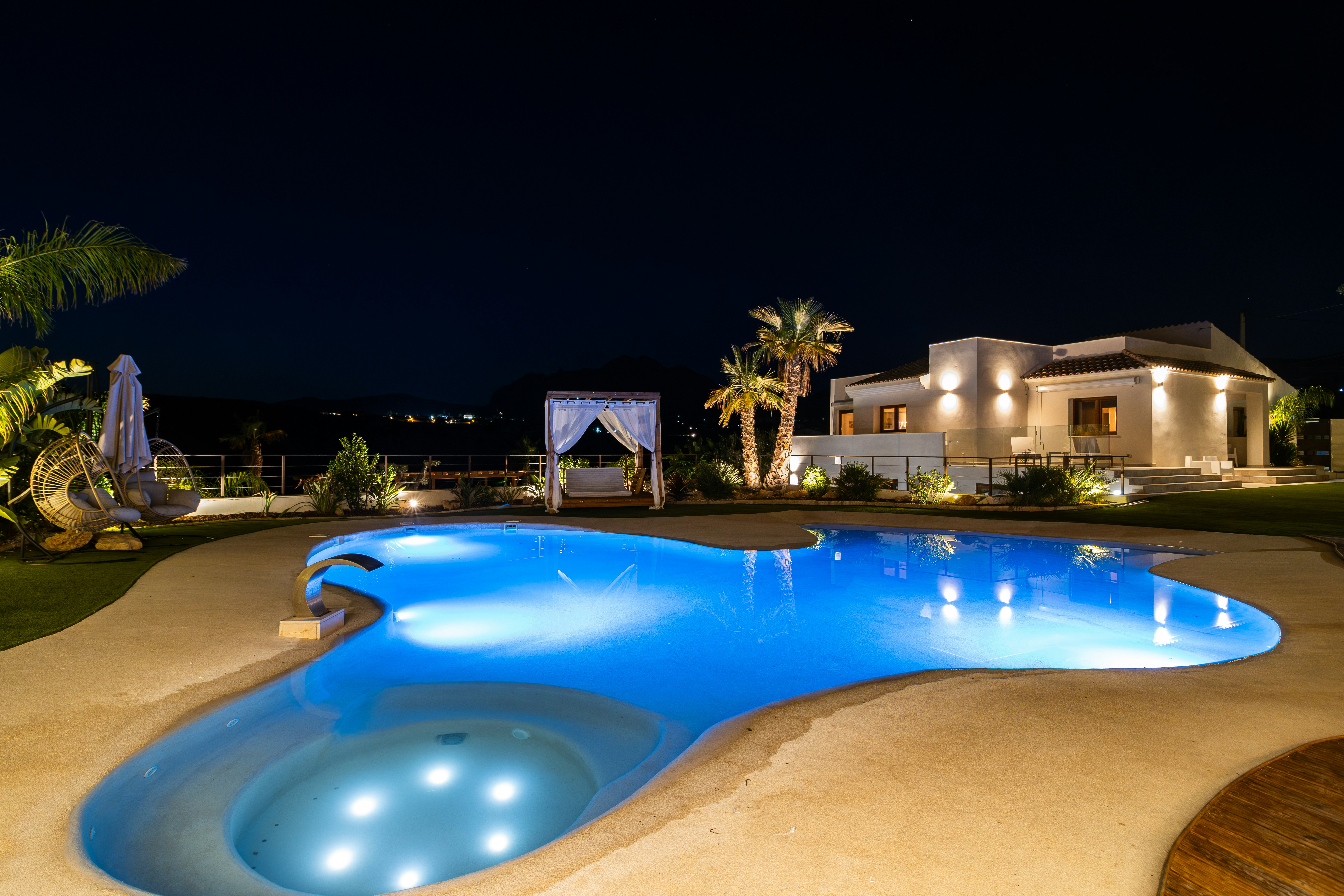 Luxury villa with illuminated pool