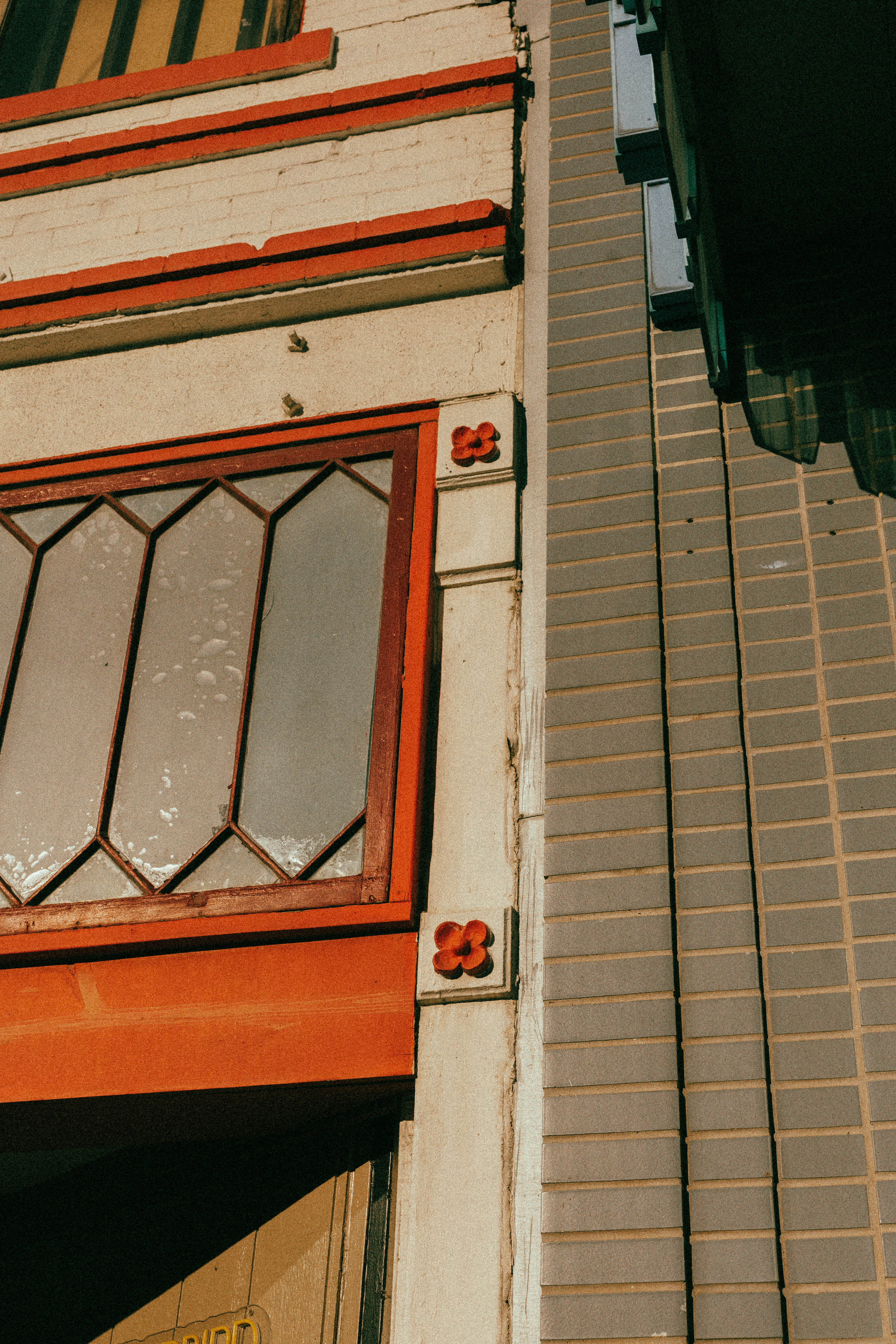 Close-up of building facade with decorative elements.