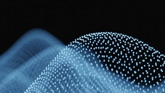 Abstract blue waves of glowing particles