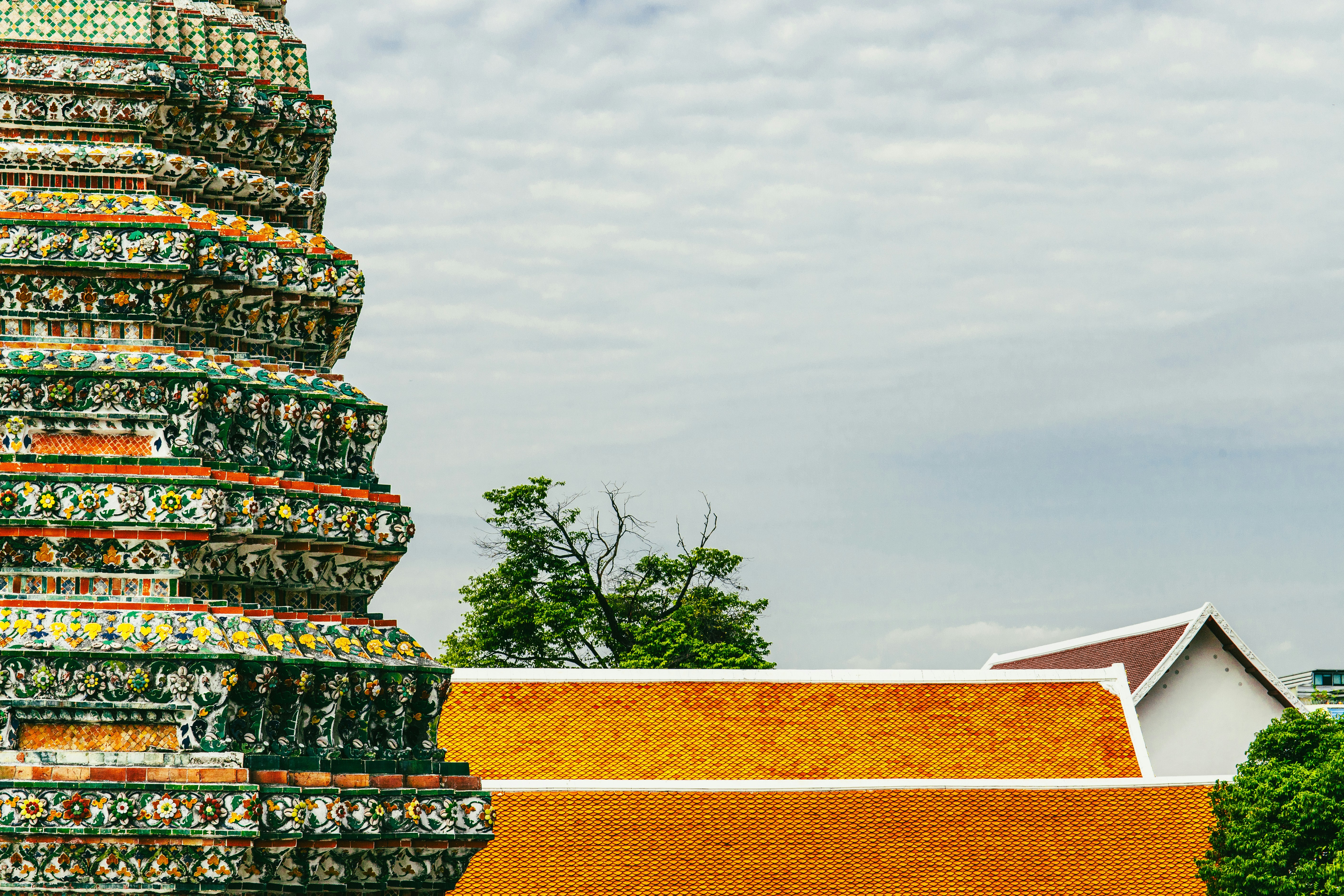 Ornate temple spire with orange tiled roofs.