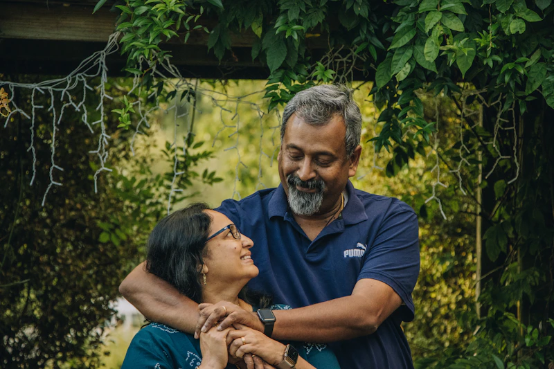 Couple embracing in a green garden