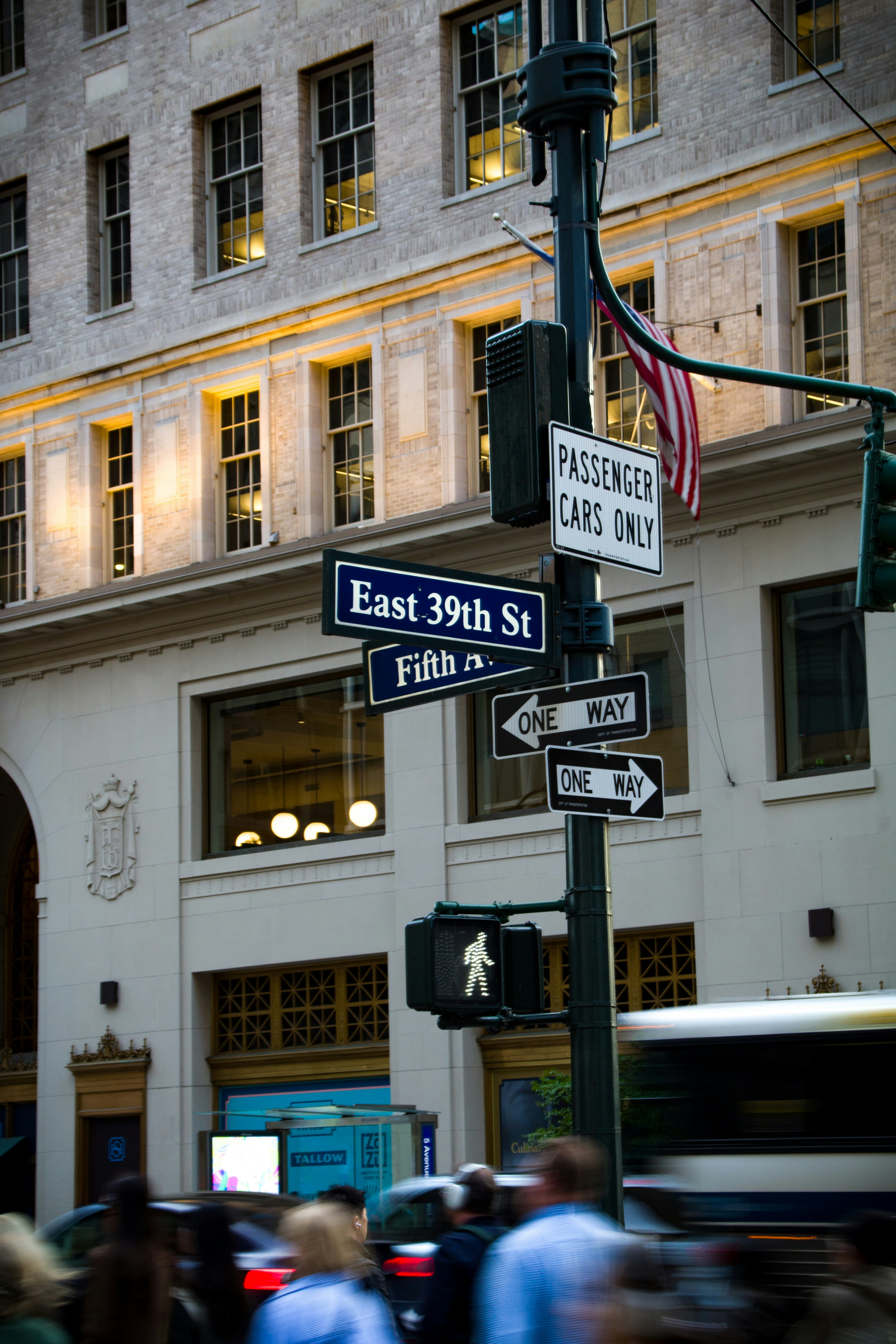 Street signs and pedestrian crossing in a city