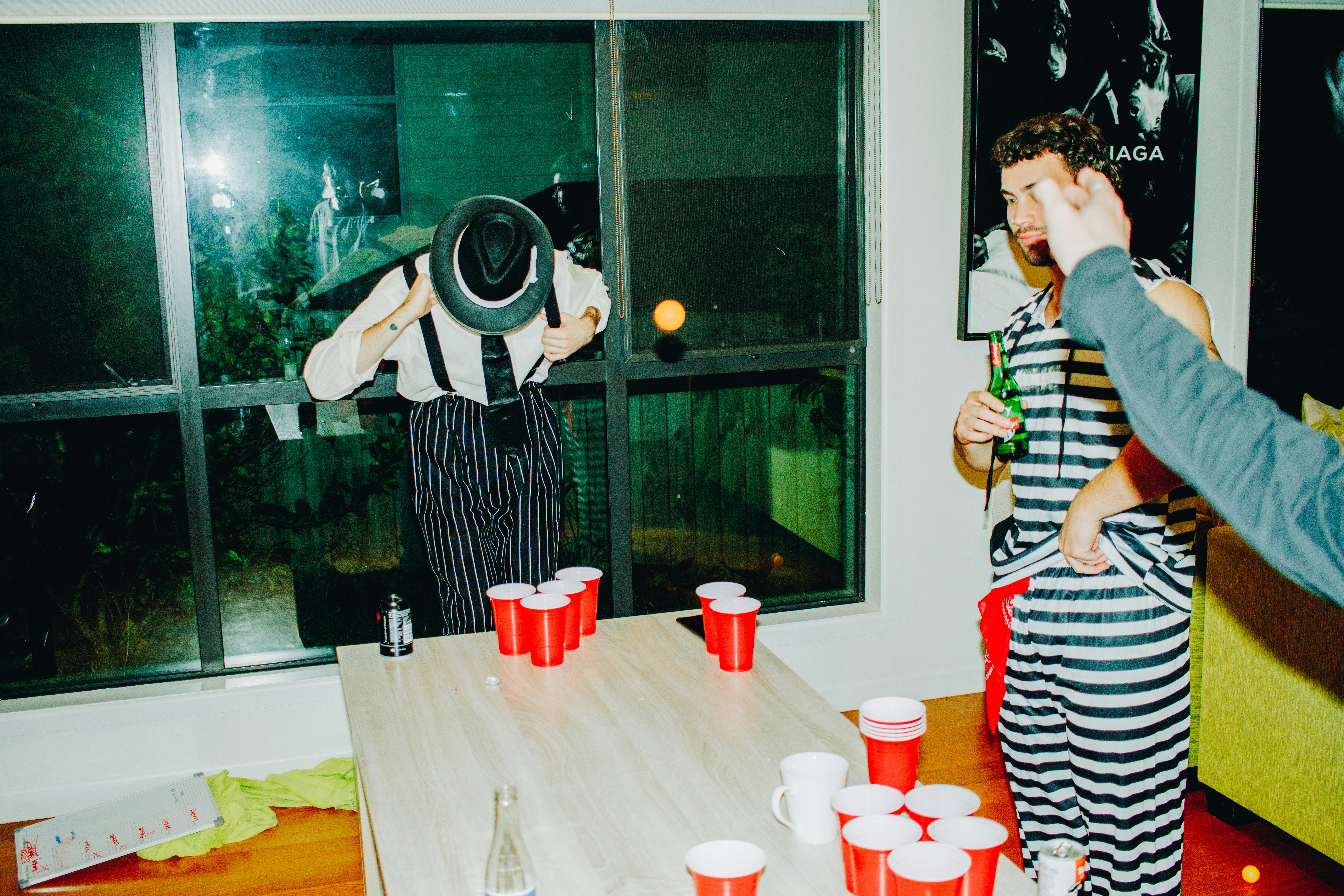 Women celebrating outdoors with drinks