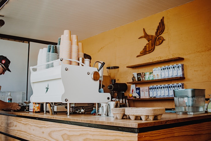 Espresso machine on a kitchen counter with coffee supplies