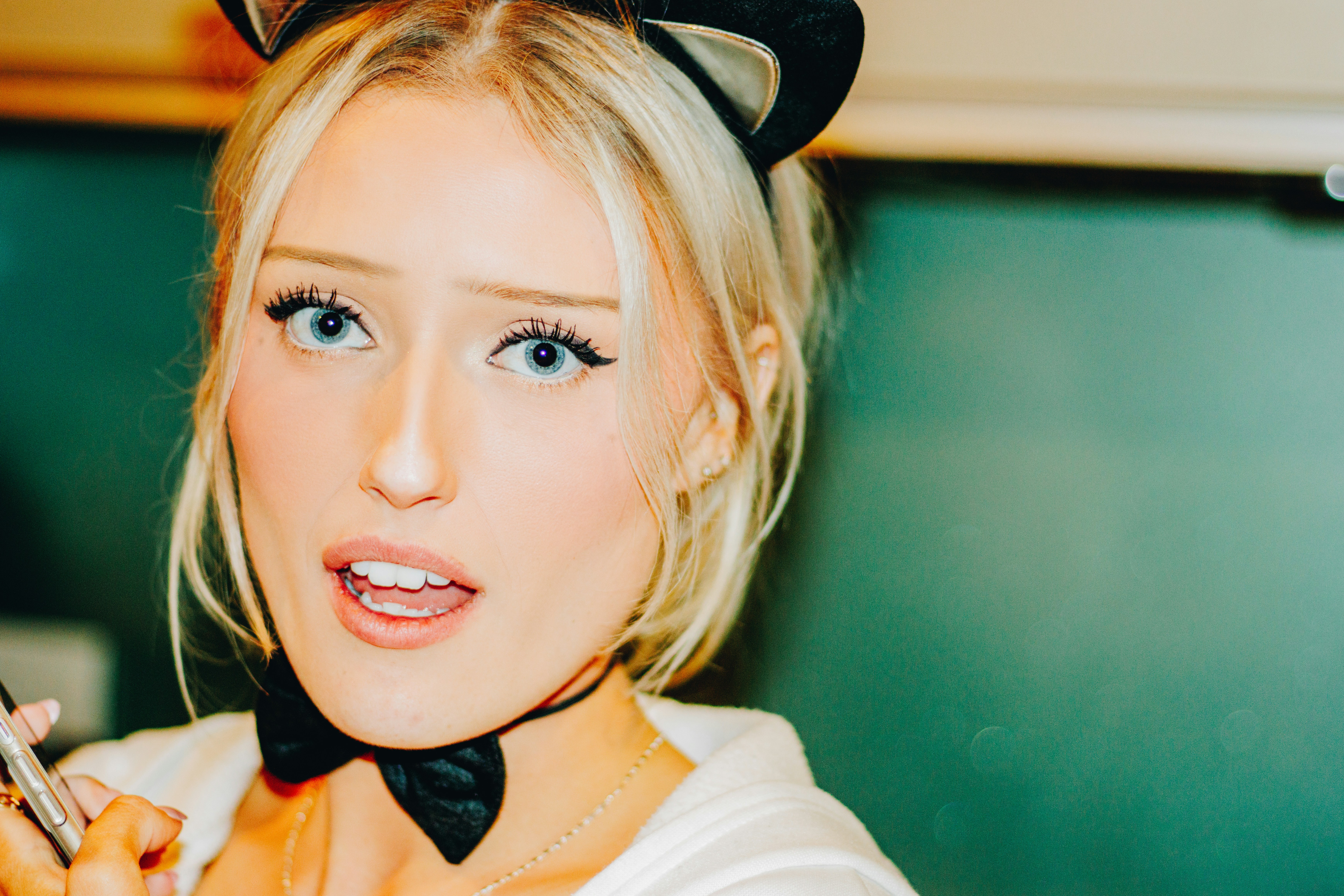 Young woman with cat ears and bow tie