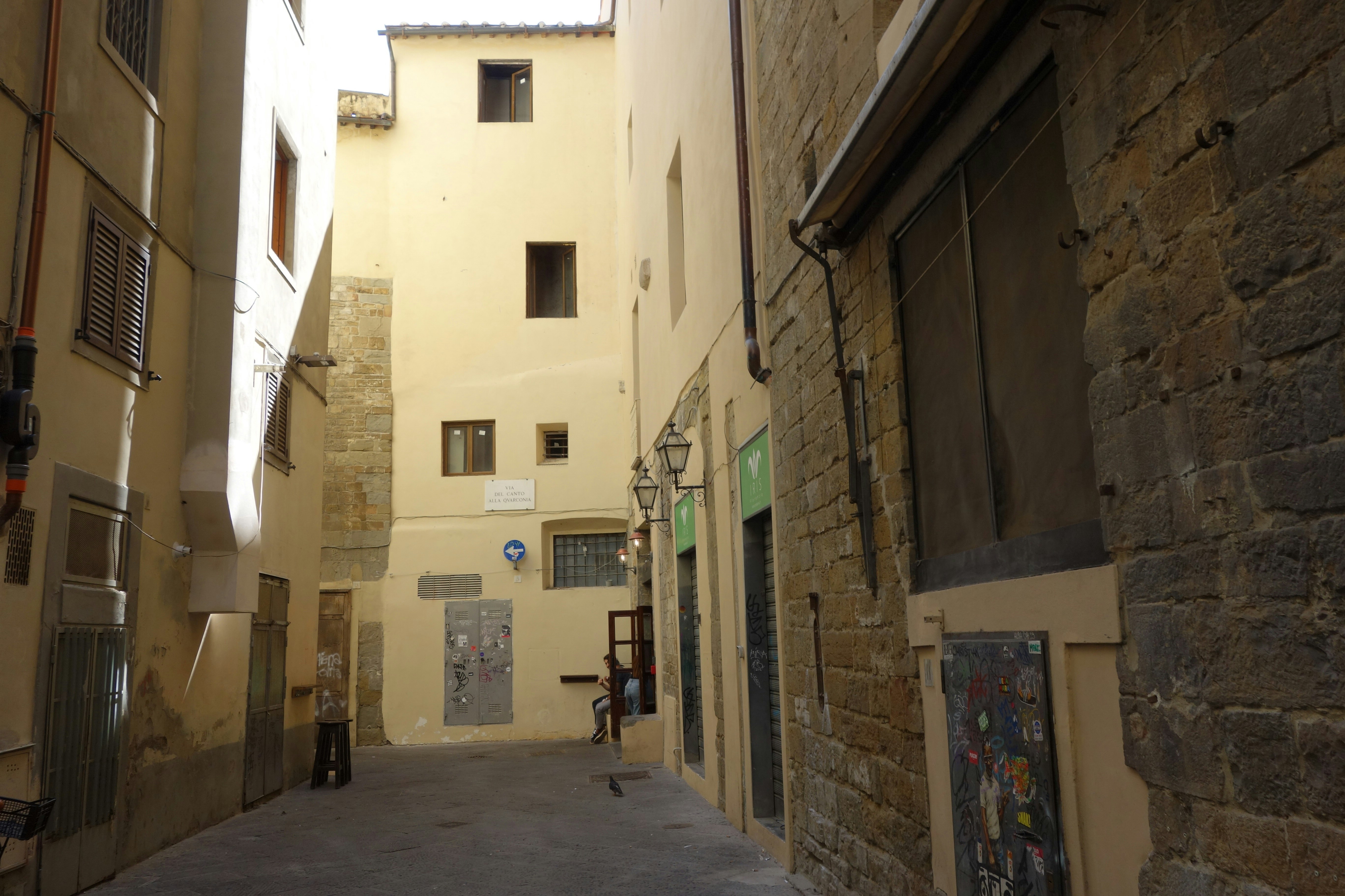 Narrow european street with old buildings and cobblestones