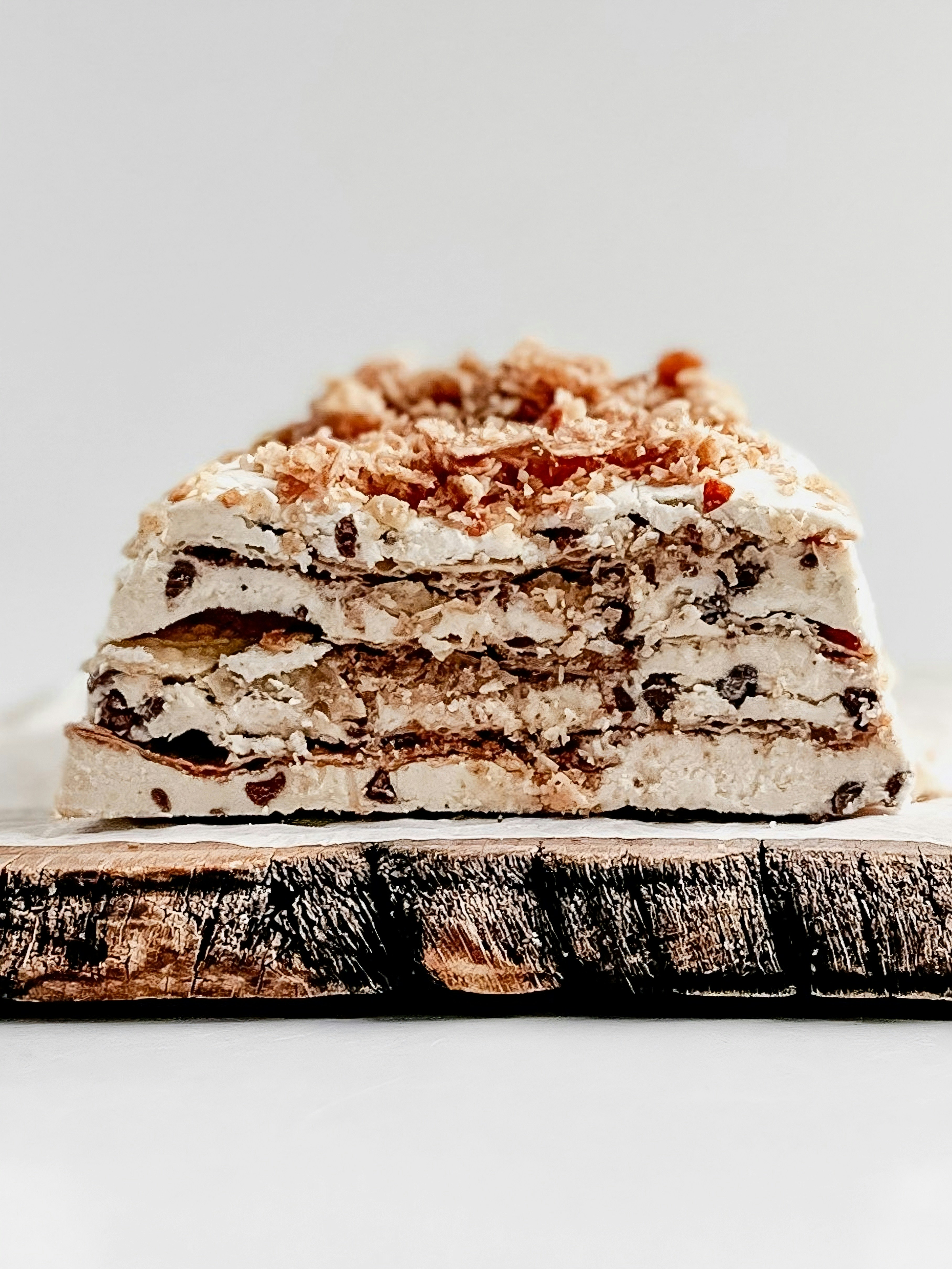Layered ice cream cake with chocolate chips and crumbs