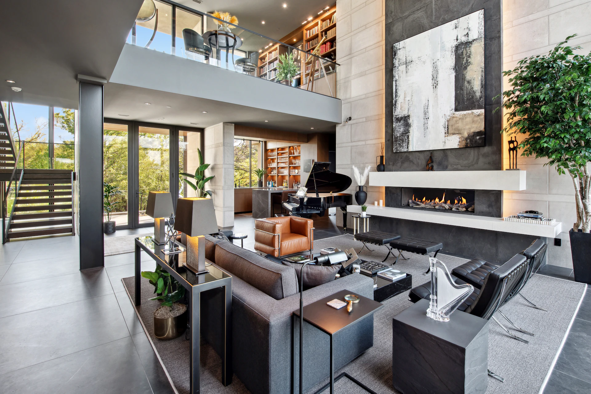 Modern living room with fireplace and grand piano.