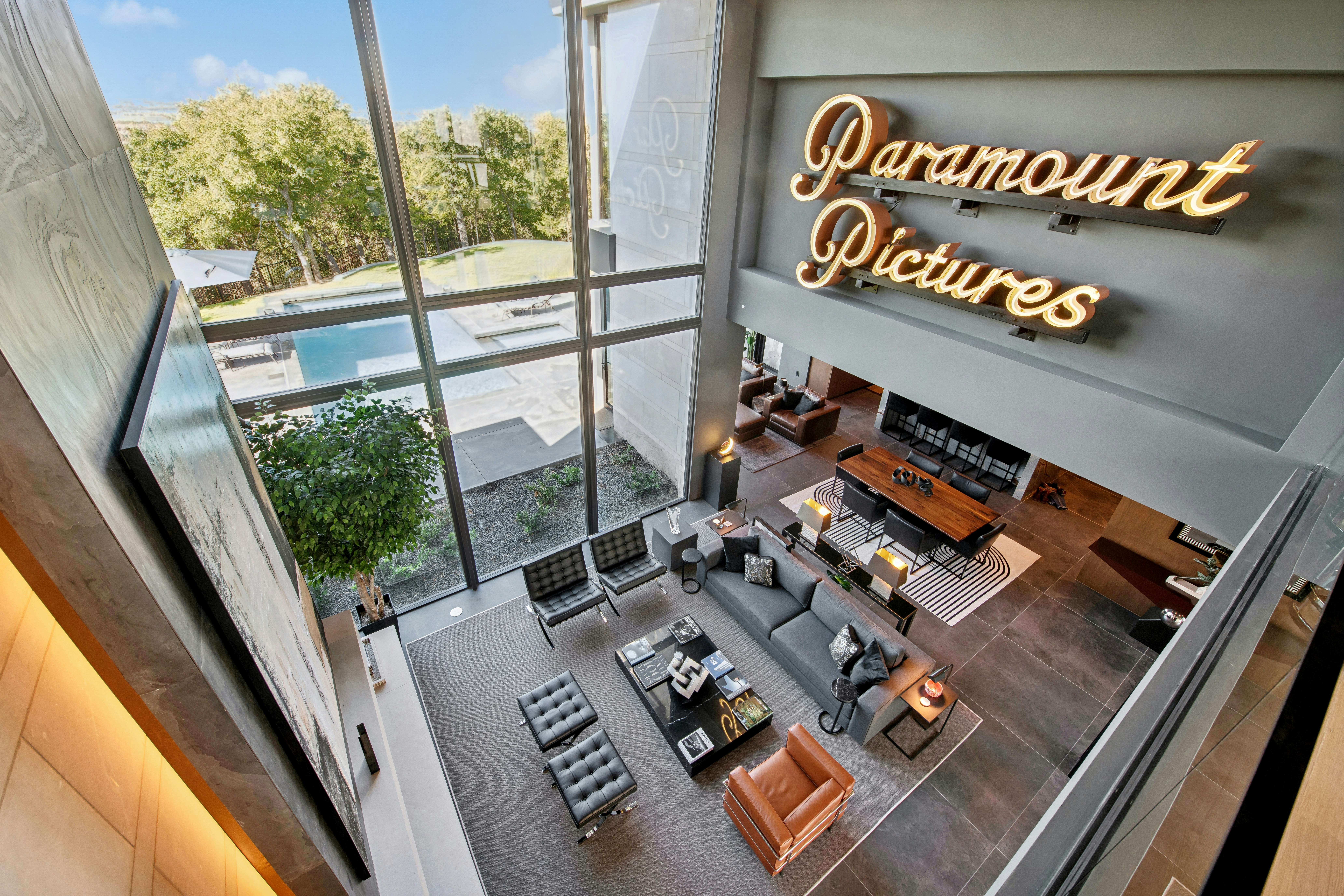 Paramount pictures logo above modern living room and pool.