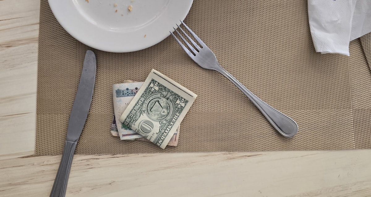 US dollar bills left as a tip on a restaurant table