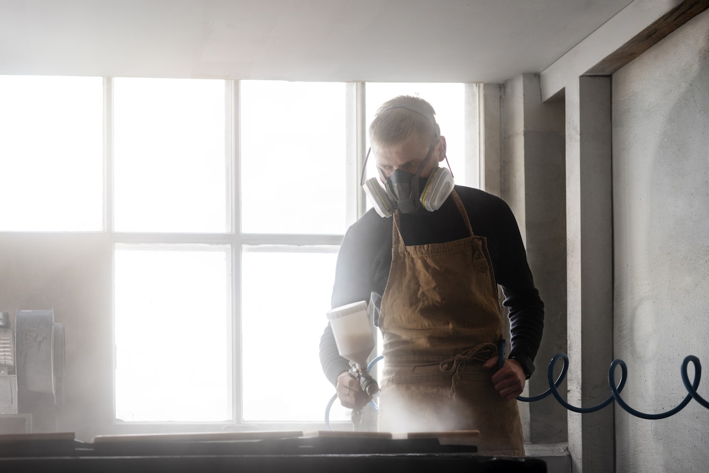 Technician cleaning a residential air duct system