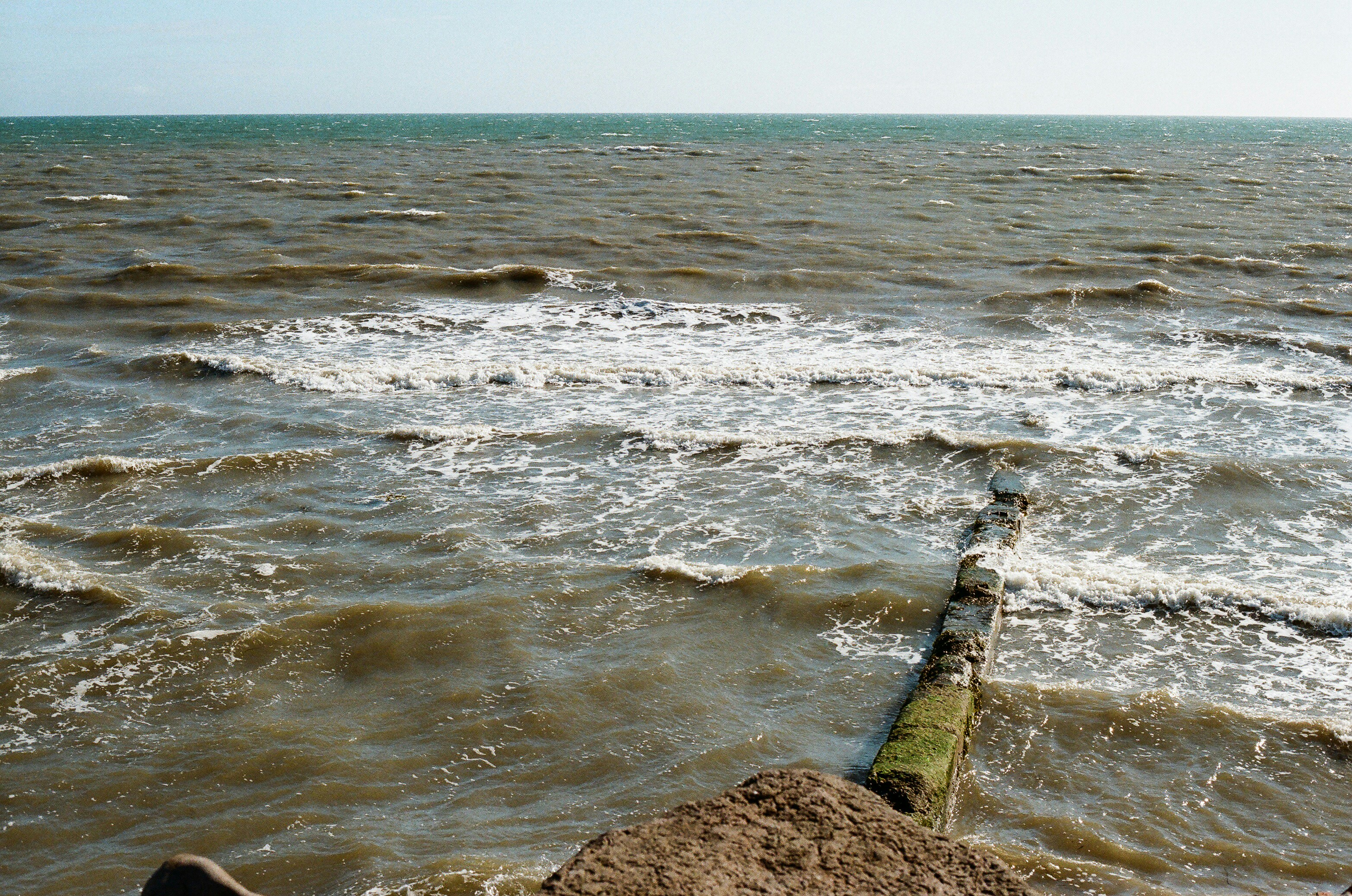 Ocean waves against breakwater