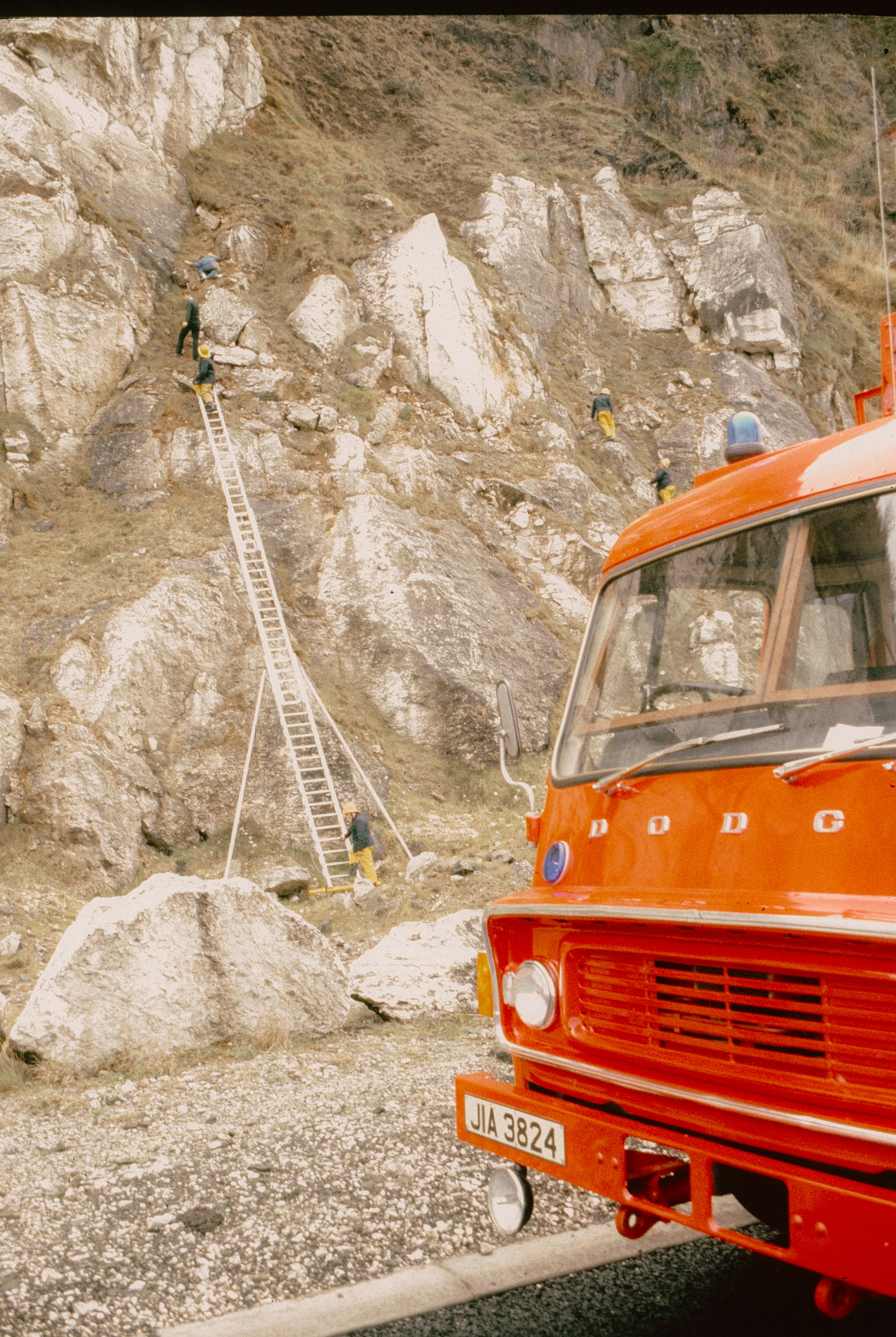 Firefighters rescue people from rocky mountainside with ladder