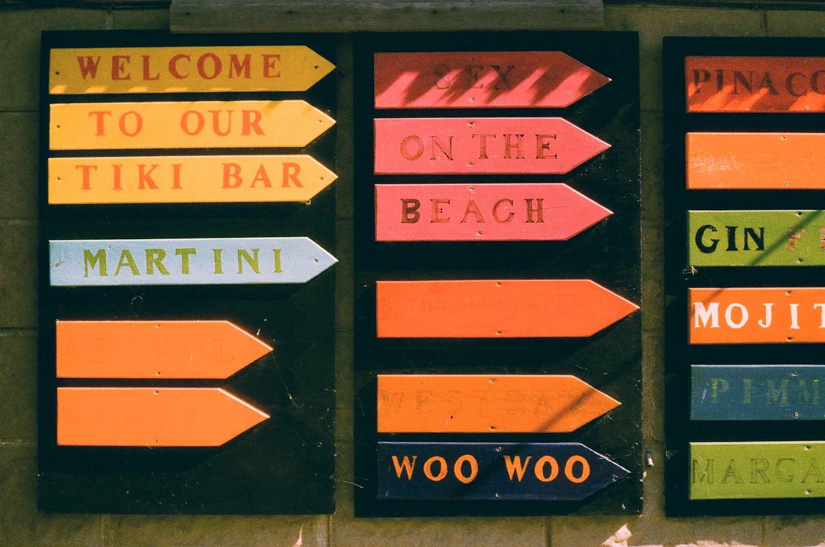 Colorful directional signs for a tiki bar