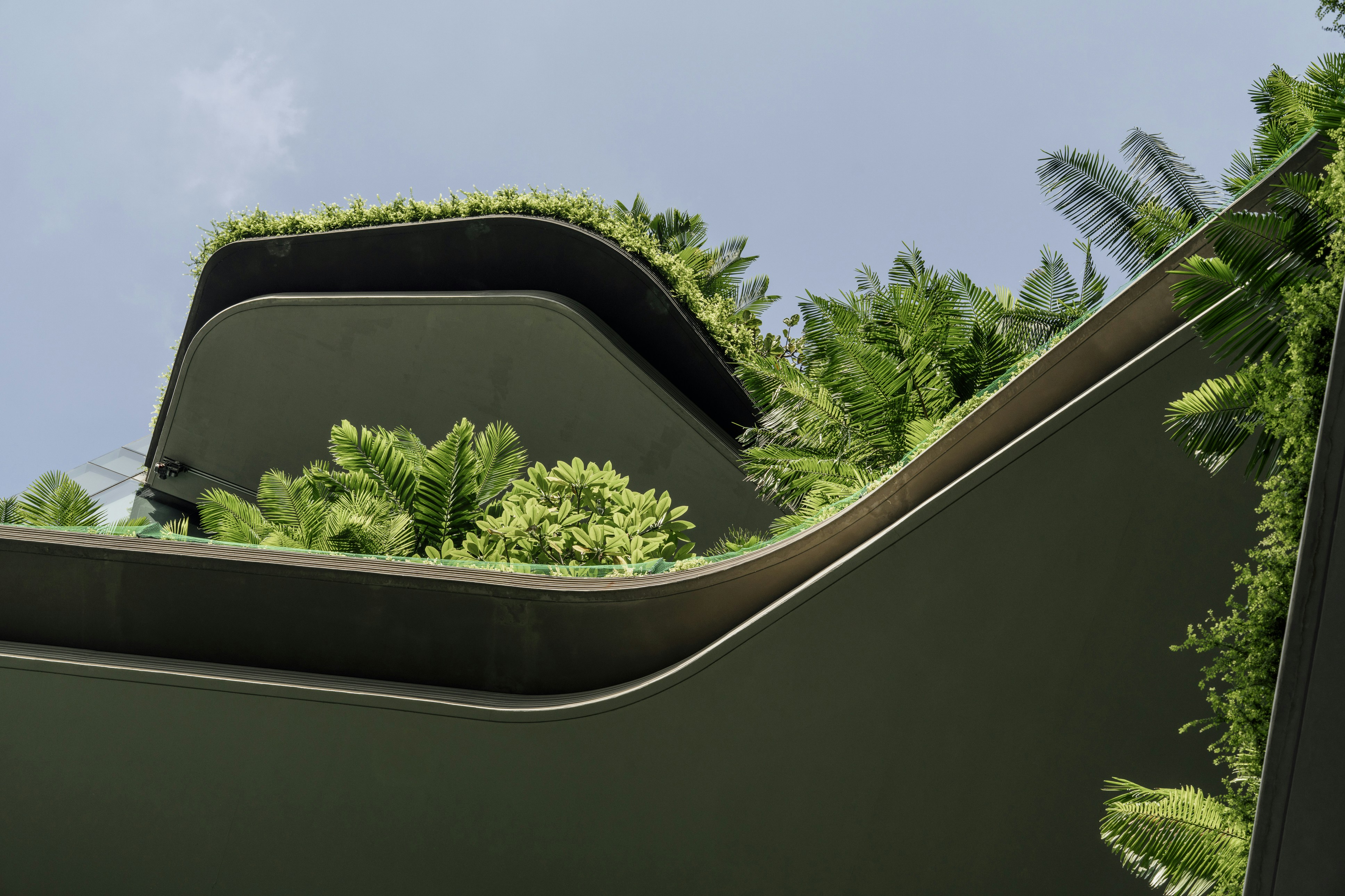 Modern building with lush green rooftop garden