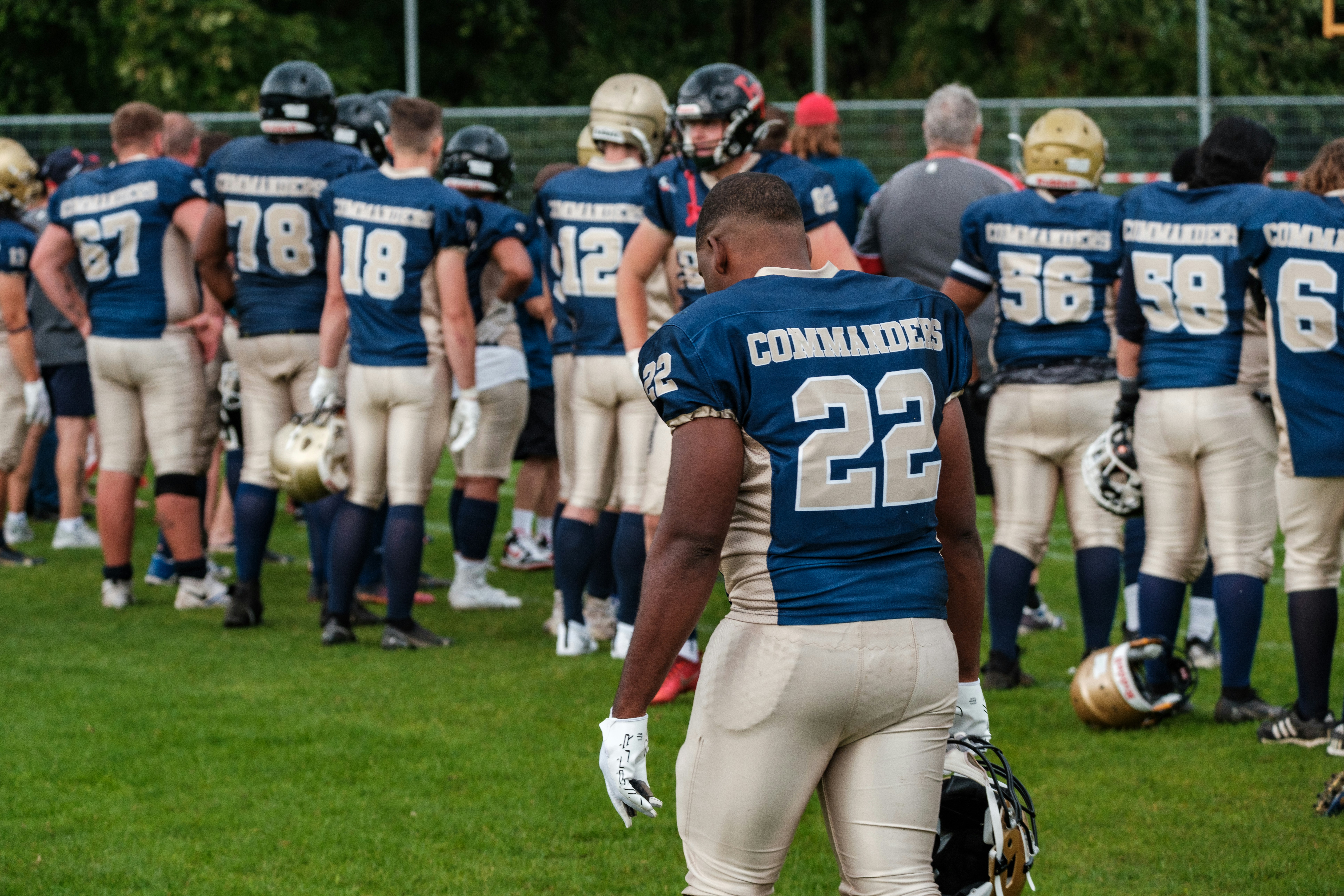 American football players in uniform on field