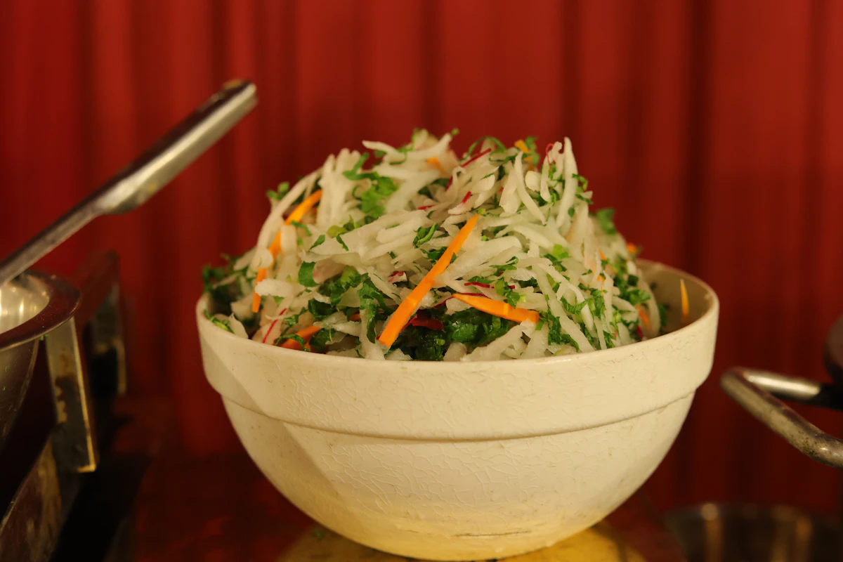 Fresh papaya and carrot salad with herbs