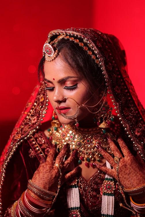 Bride in ornate traditional indian wedding attire.