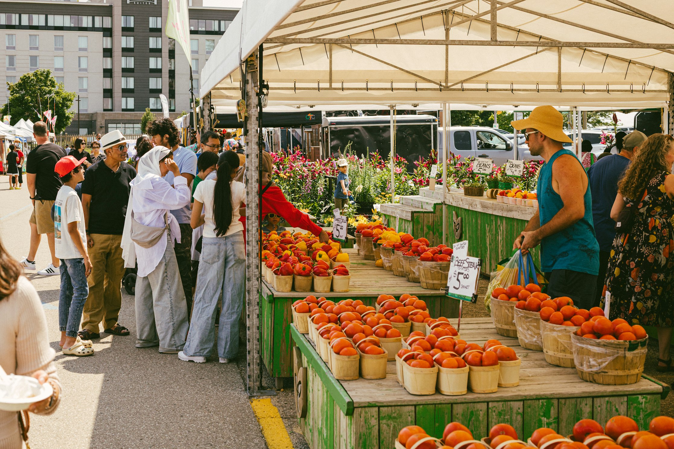 Vendor stalls with fresh produce at an outdoor market