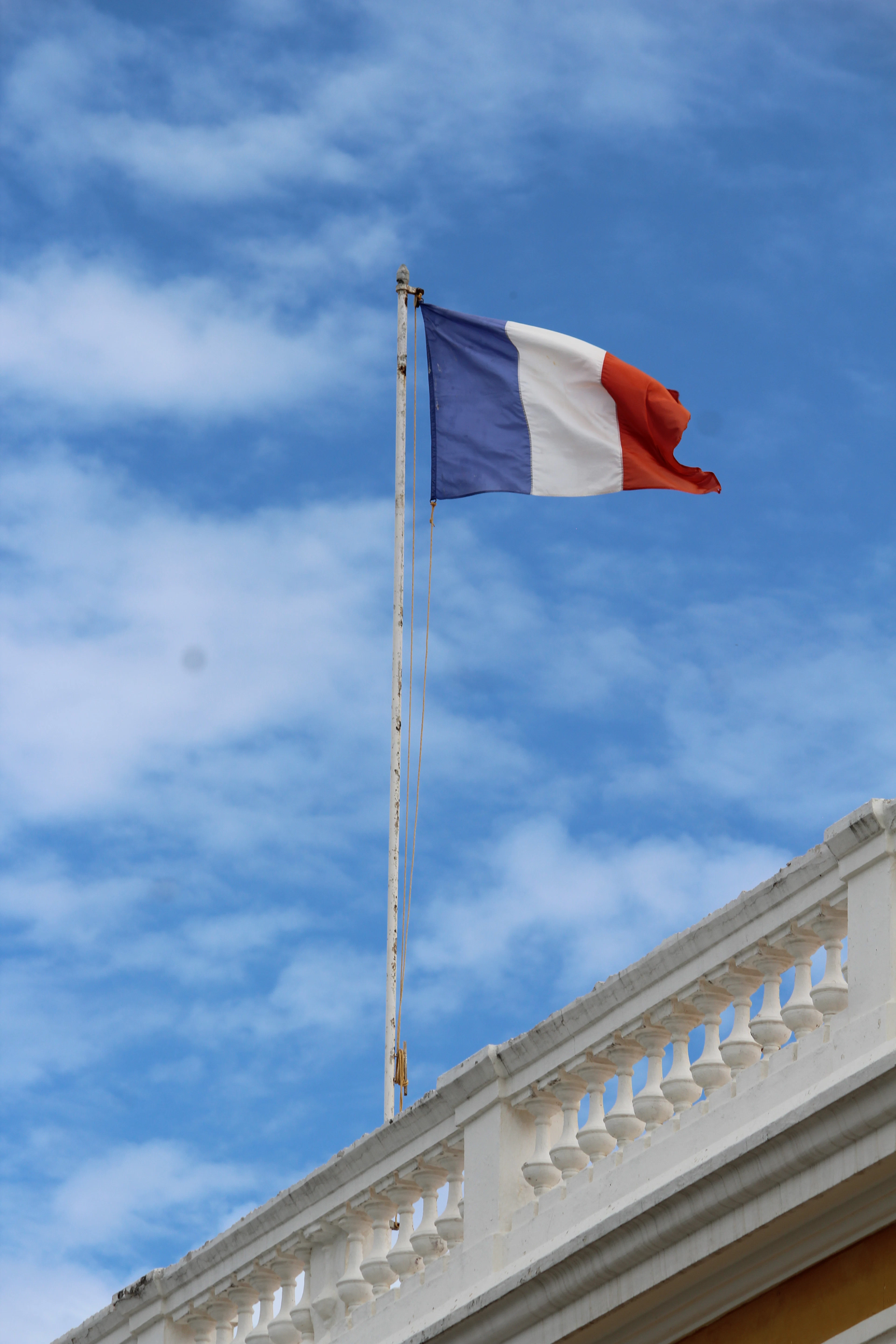 The French flag against a blue sky