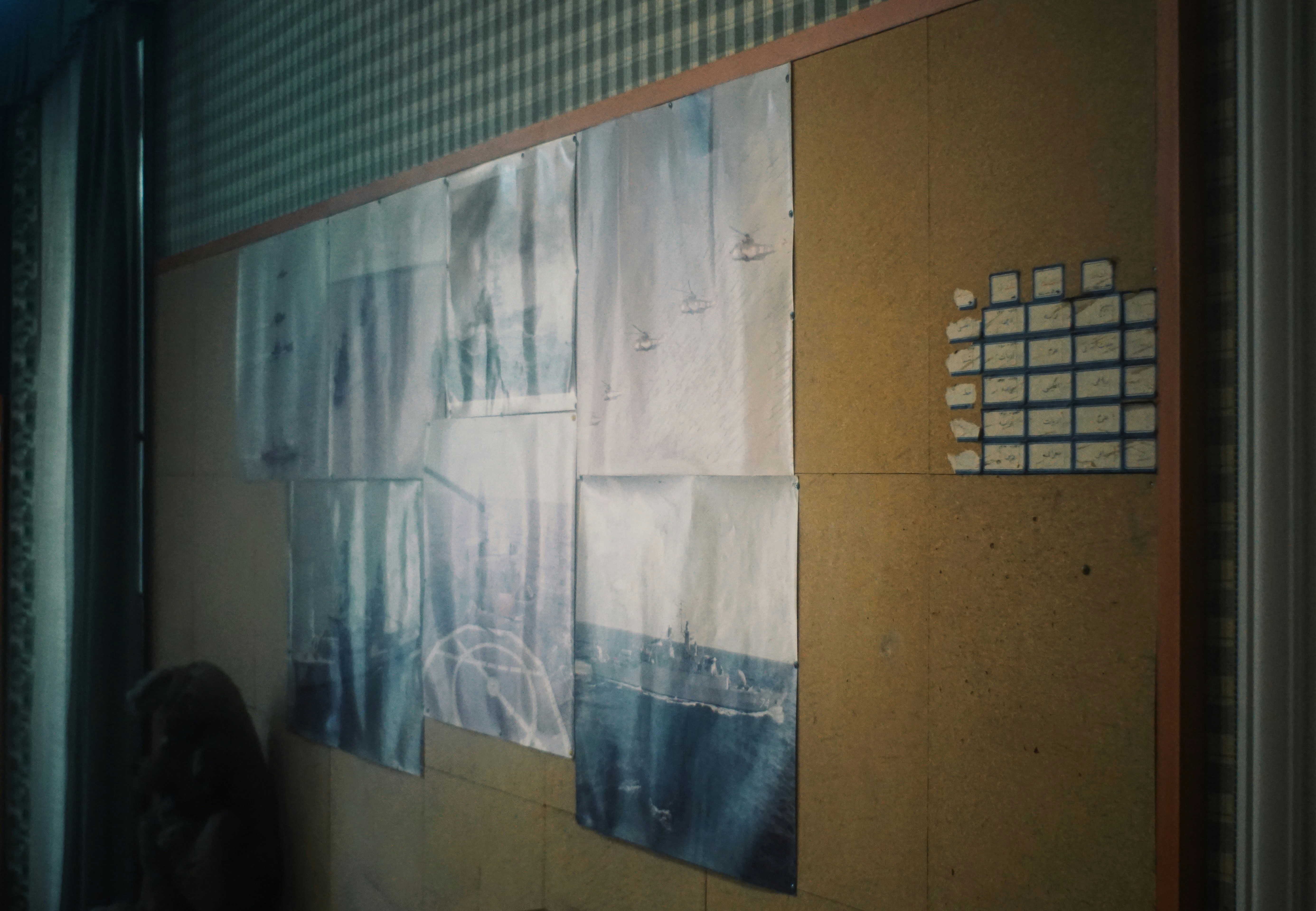 Papers and notes on a textured wall