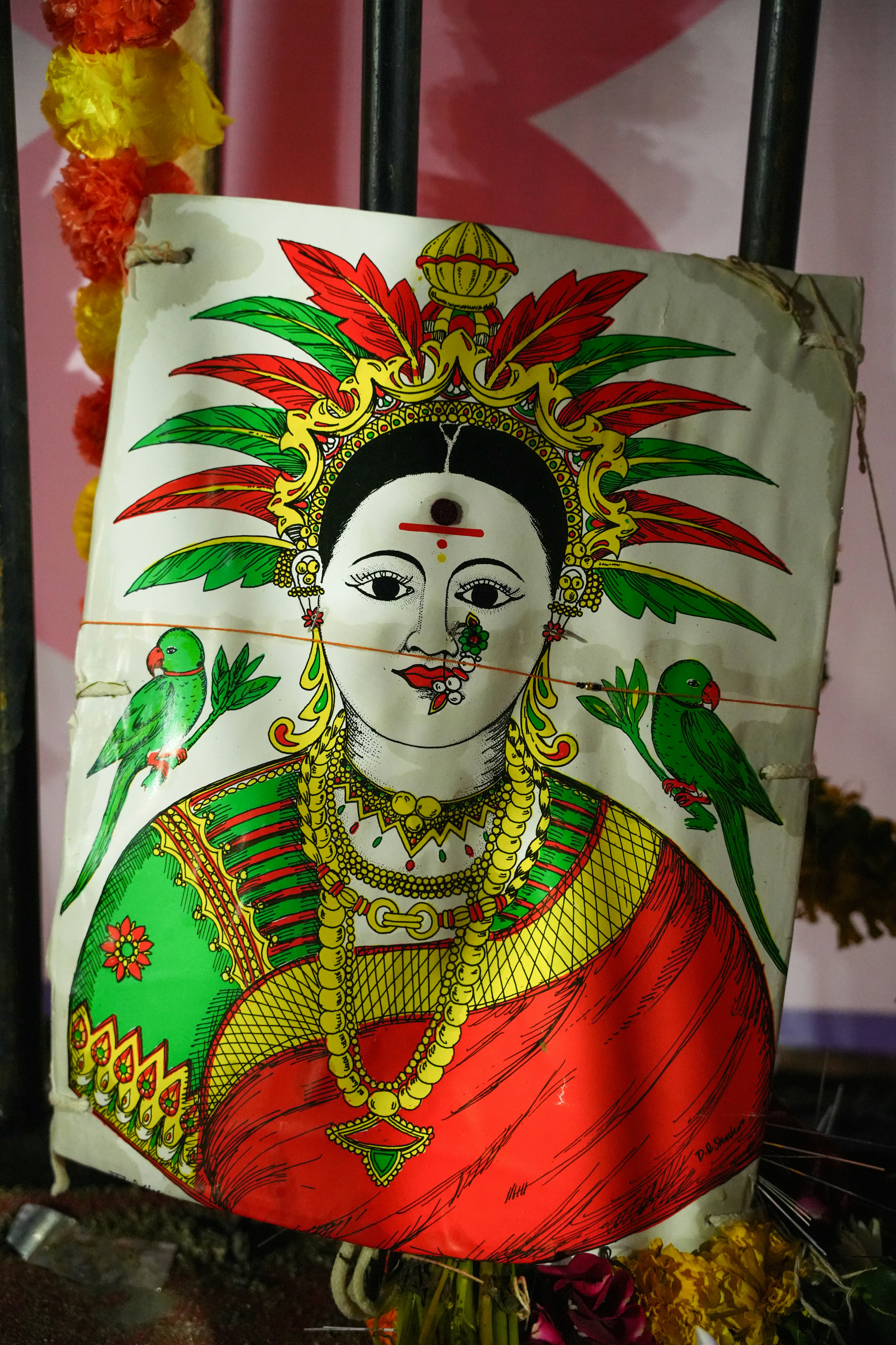 Traditional indian folk art painting of a woman with parrots.