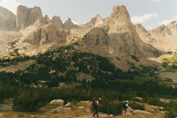 Hikers near mountain peaks