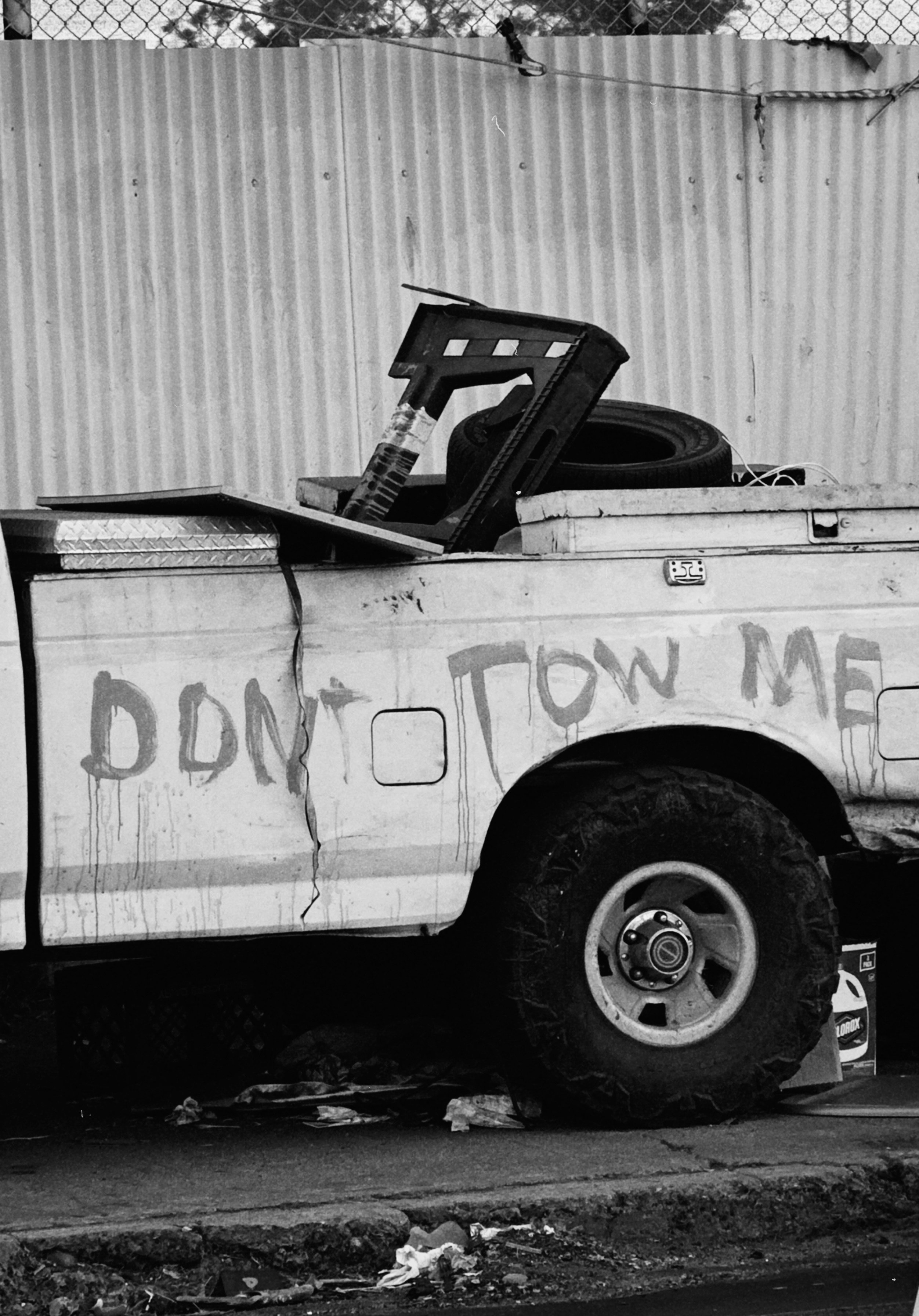 Old truck with "don't tow me" written on side.