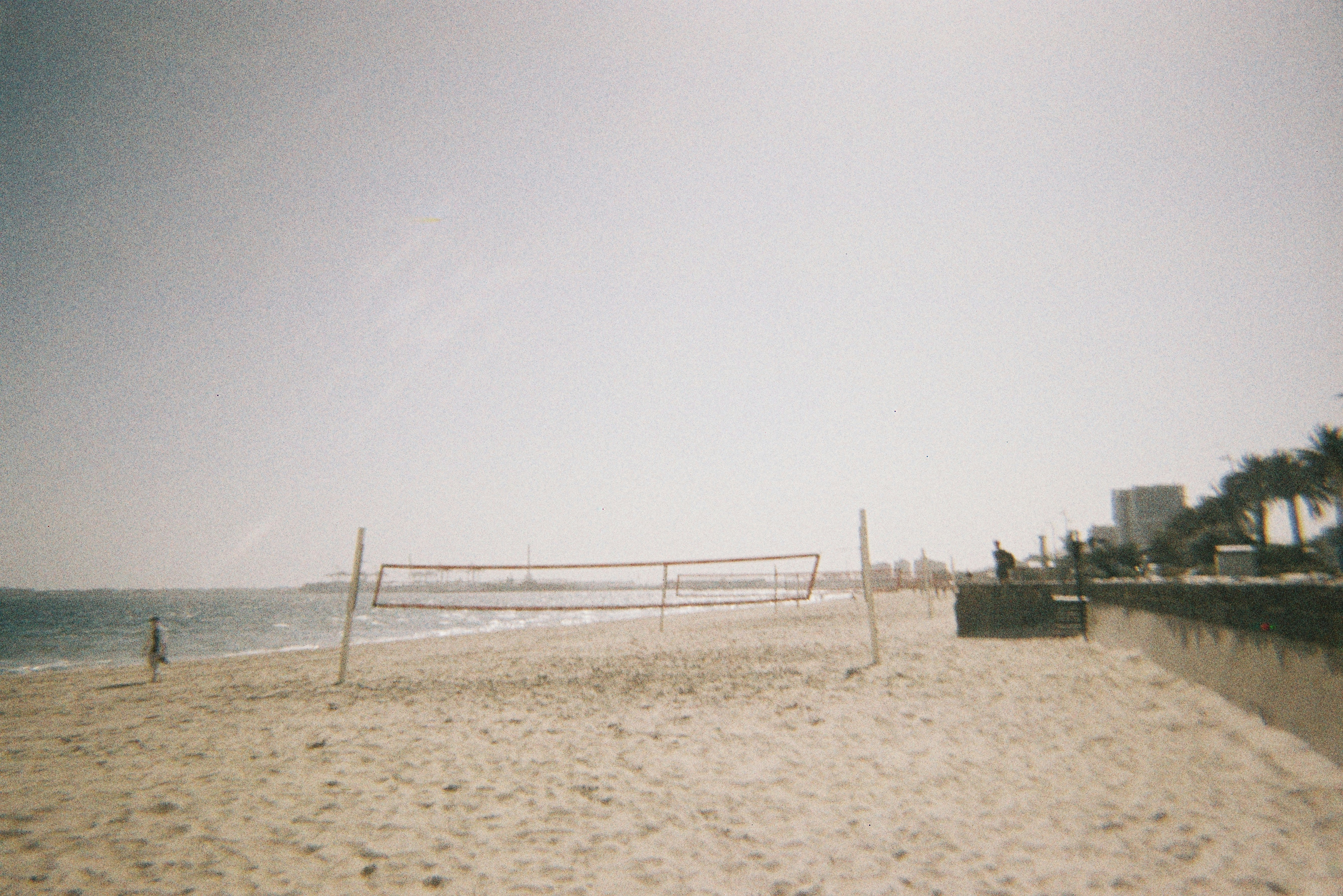 Beach with volleyball net and ocean view of the ocean