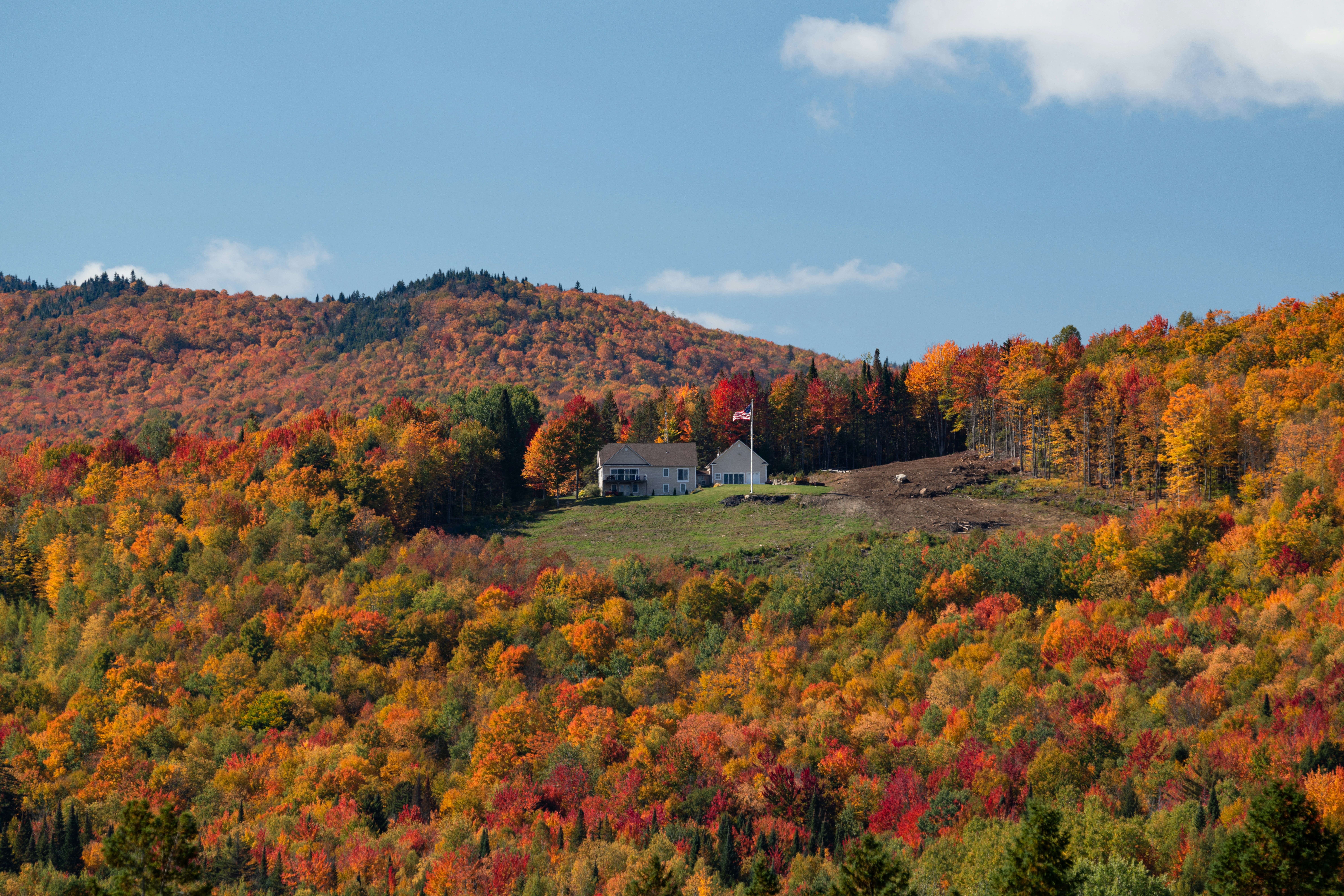 New England home with fall foliage - average home insurance cost
