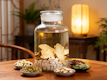 Herbal medicine ingredients in a large glass jar.