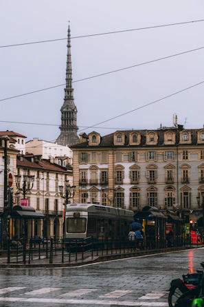 Tram on a rainy day with mole antonelliana in background