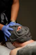 Spa treatment with a towel covering the face.